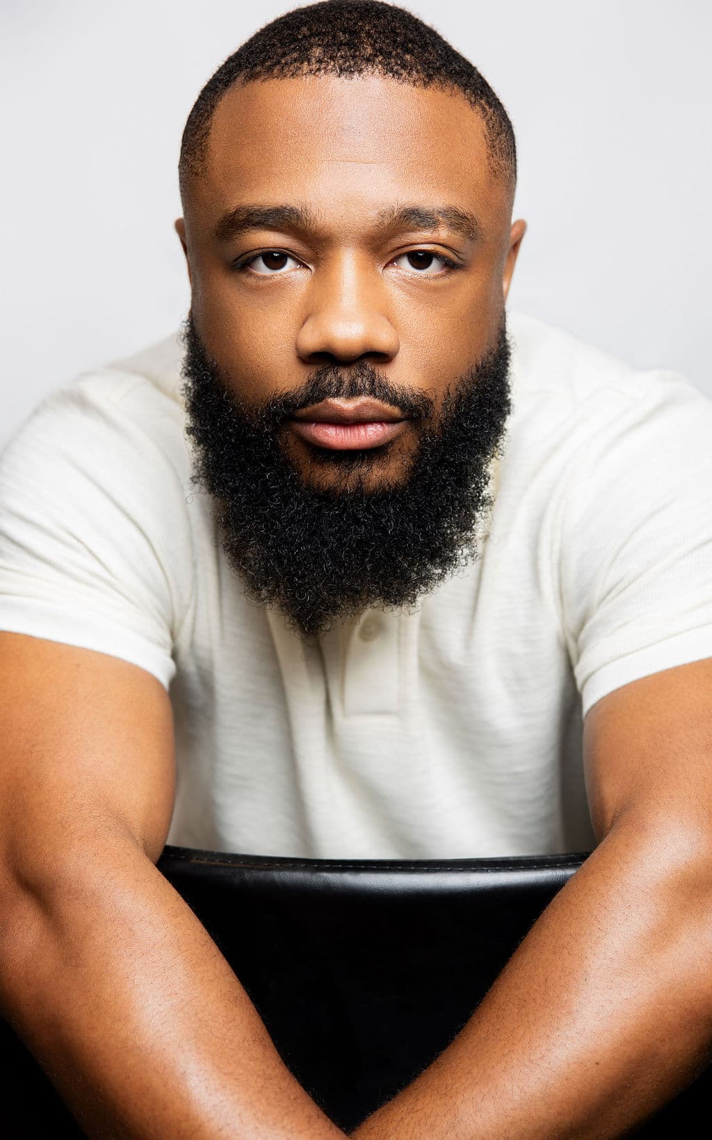 Kevin, the creator behind Stamped By Kev, in a studio portrait